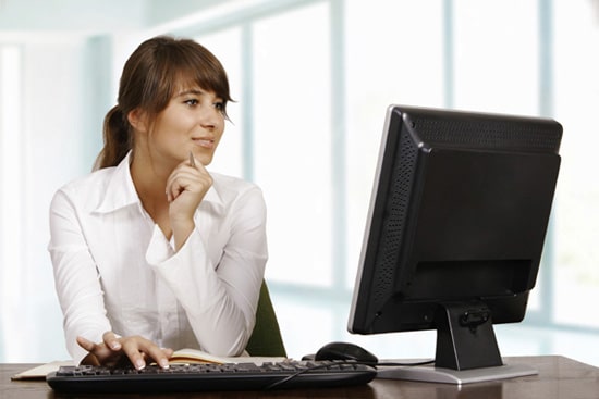 Young woman working with computer
